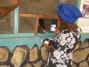 woman purchases antimalarials in Africa