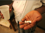Person holds medicines in hand